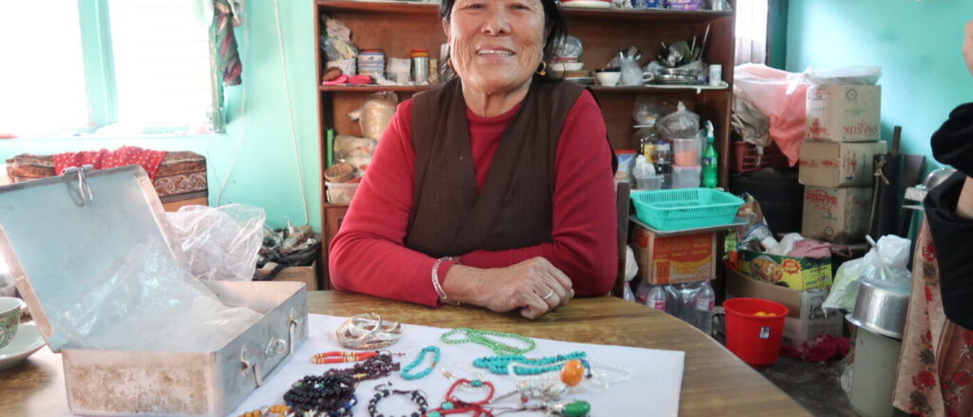 Tibetan women in her home