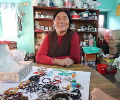 Tibetan women in her home